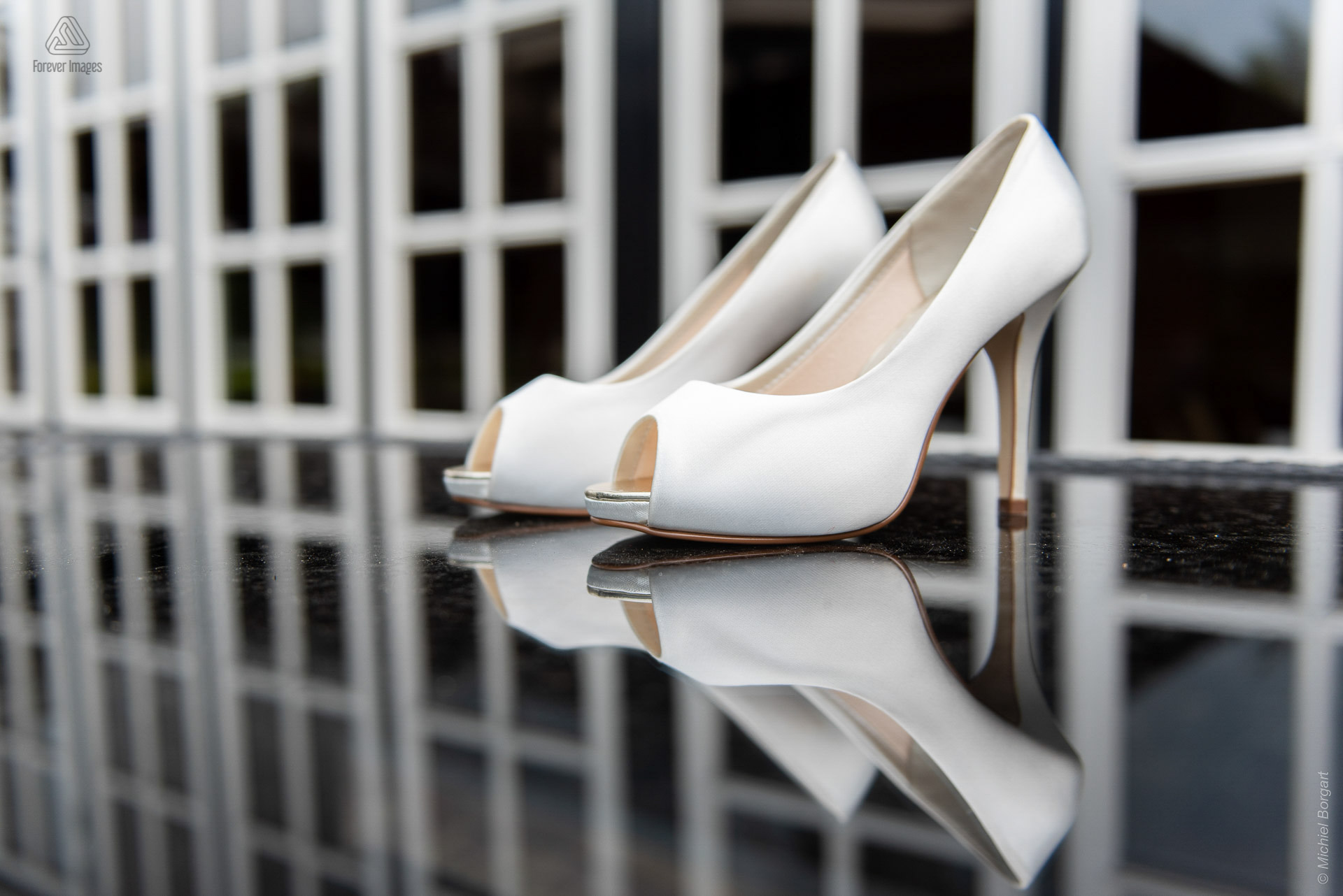 Wedding photo detail bridal shoes white side | Wedding Photographer Michiel Borgart - Forever Images.