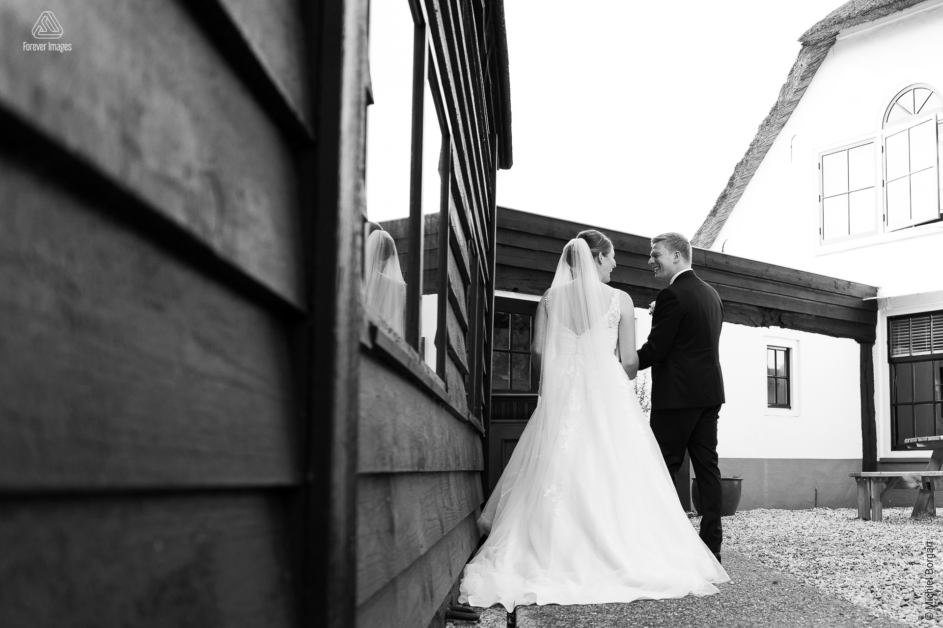 Black and white bridal photo together towards a bright future | Aaron Emmy Kloosterhoeve | Wedding Photographer Michiel Borgart - Forever Images.