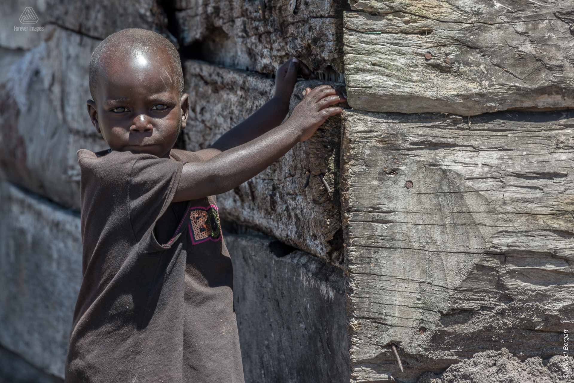 Portrait photo of a child in Uganda during the Muskathlon of 2015 | Portrait Photographer Michiel Borgart - Forever Images.