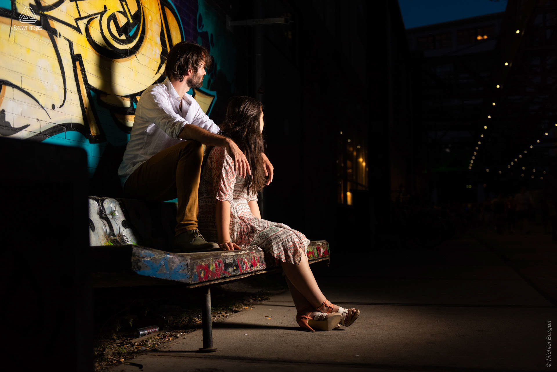 Portrait photo couple on concrete sofa between graffiti | Strijp | Portrait Photographer Michiel Borgart - Forever Images.